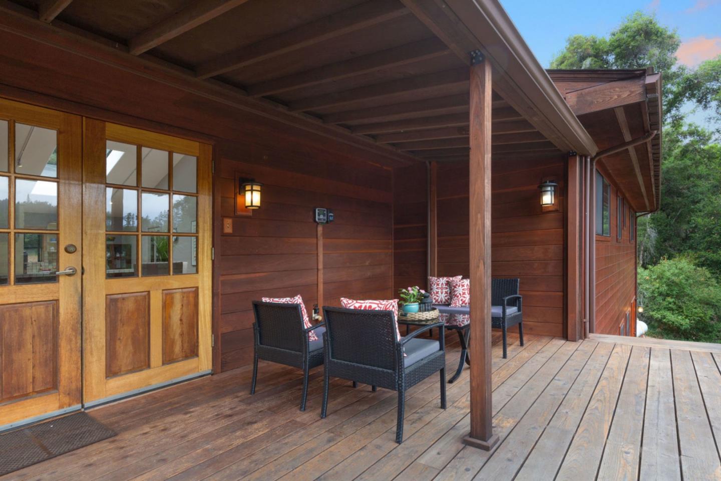 2060 Sparrow Valley Road Aptos, CA 95003 - Photo 5 of 45 a view of a roof deck with table and chairs and wooden floor