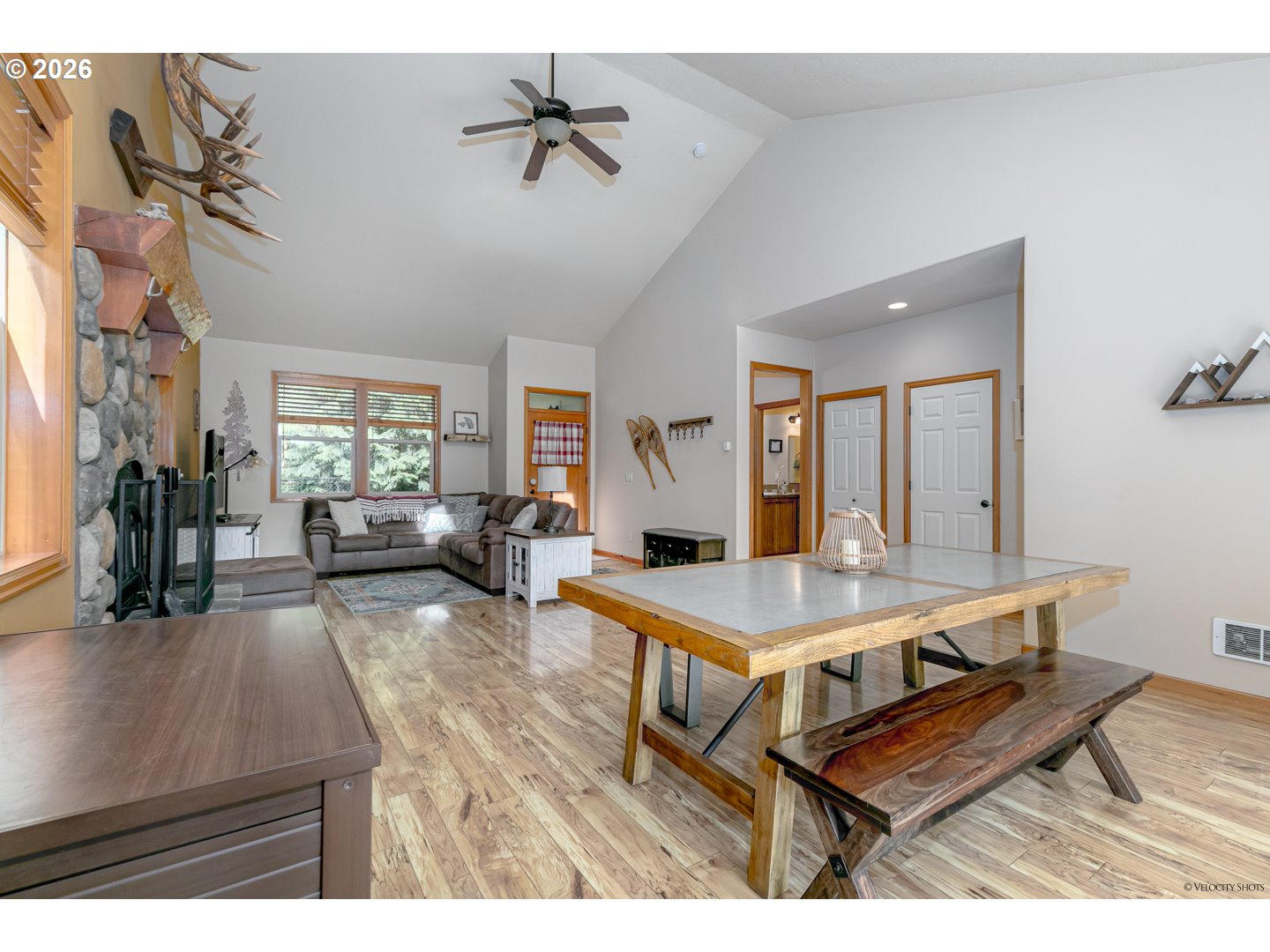 64636 Mc Intyre Road Rhododendron, OR 97049 - Photo 13 of 48 a living room with furniture a table and wooden floor