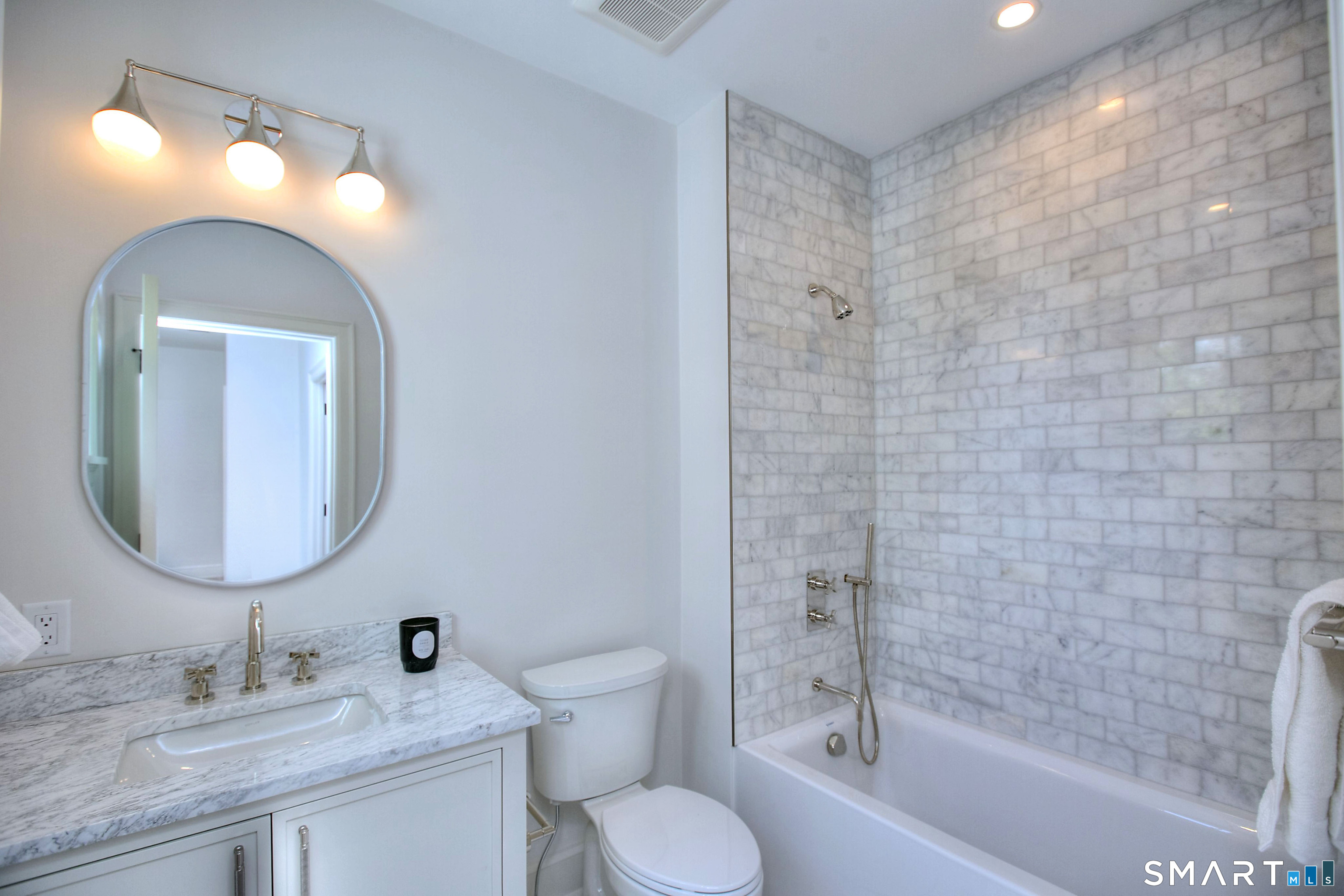 48 Kettle Creek Road Weston, CT 06883 - Photo 20 of 40 a bathroom with a toilet sink and mirror