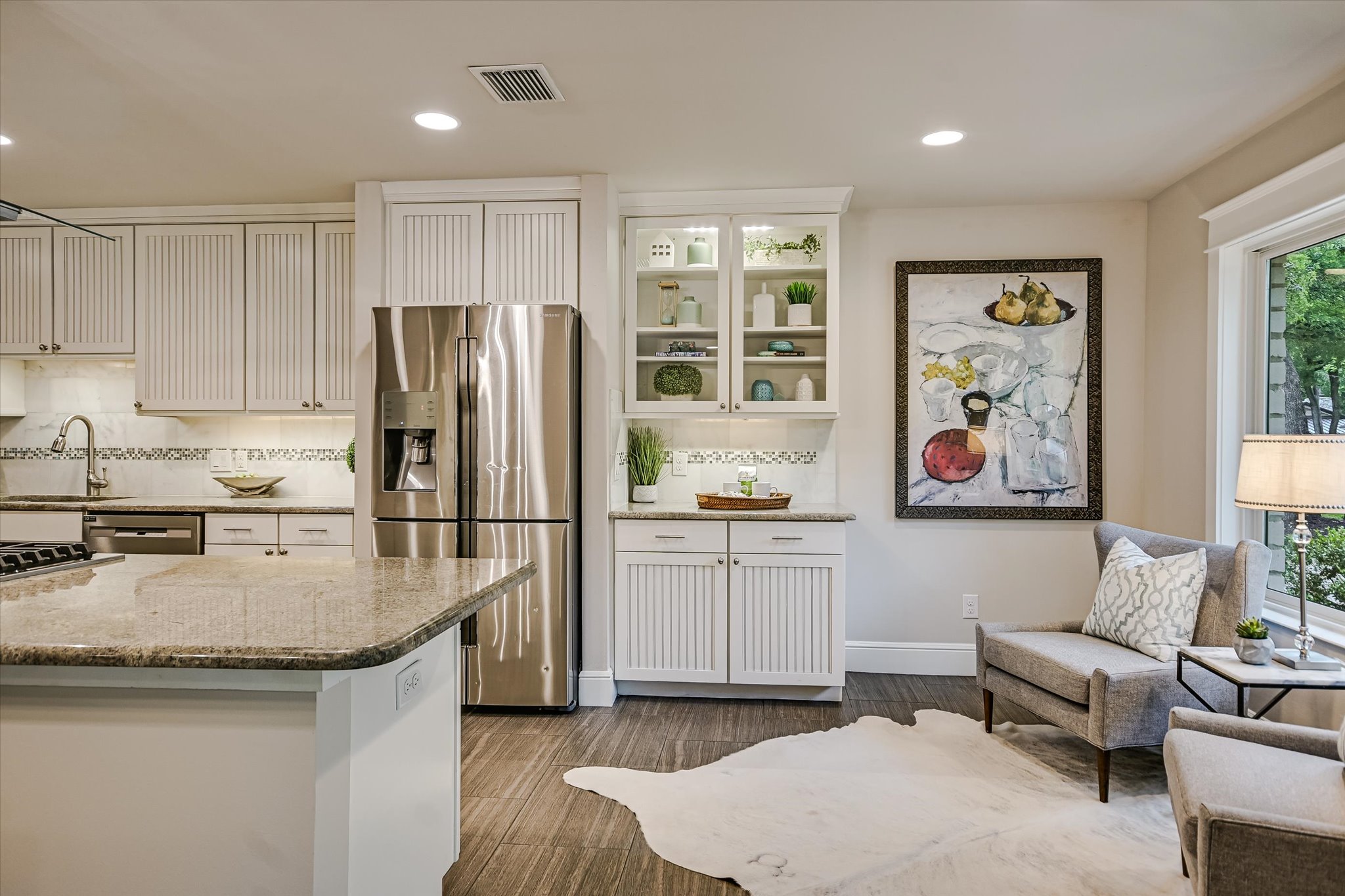 8602 Silver Ridge Drive Austin, TX 78759 - Photo 11 of 40 A glass-front cabinet provides the perfect place to display treasured pieces and décor.