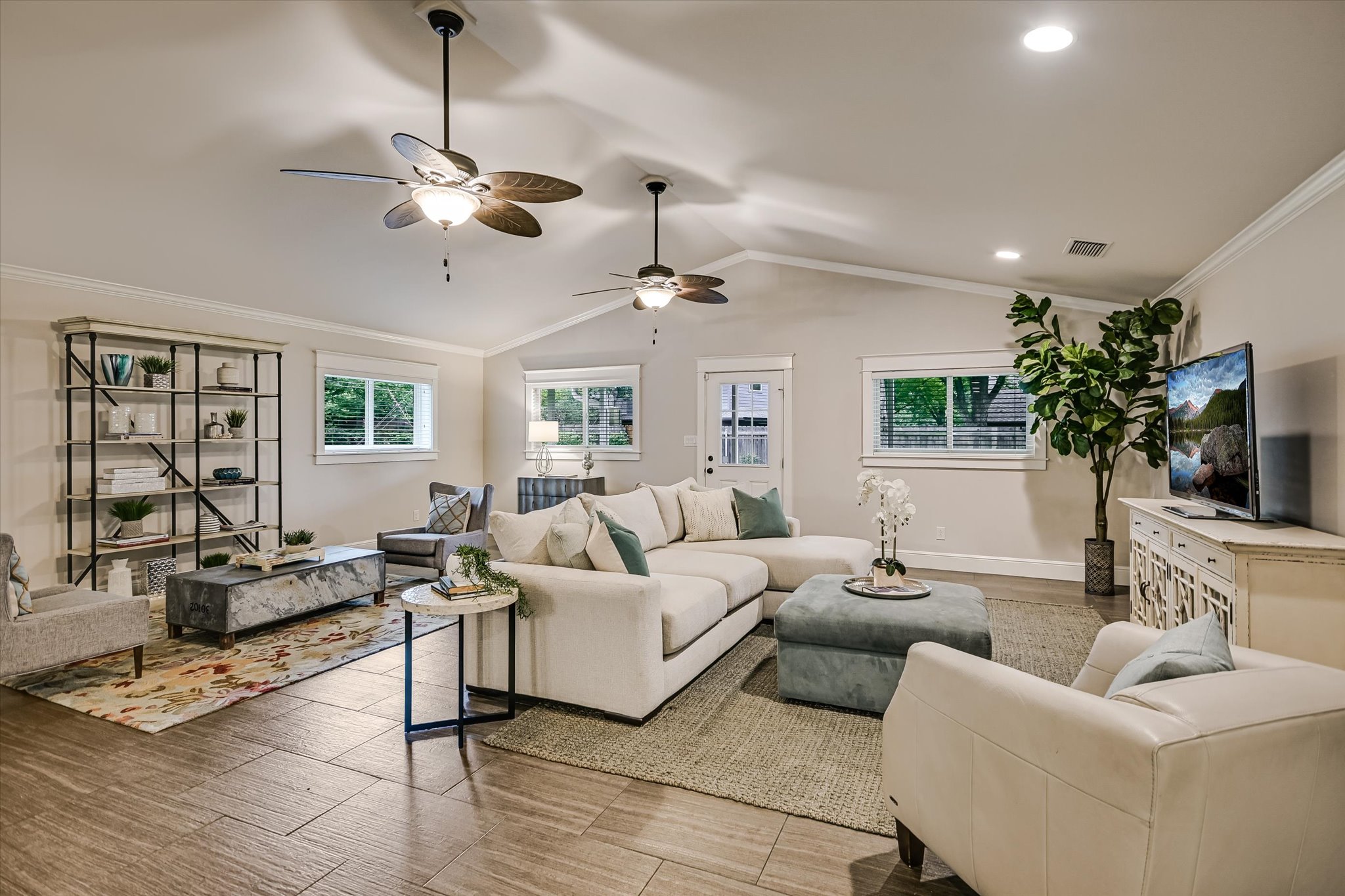 8602 Silver Ridge Drive Austin, TX 78759 - Photo 12 of 40 A cathedral ceiling elevates the spacious living area, adding light and architectural interest.