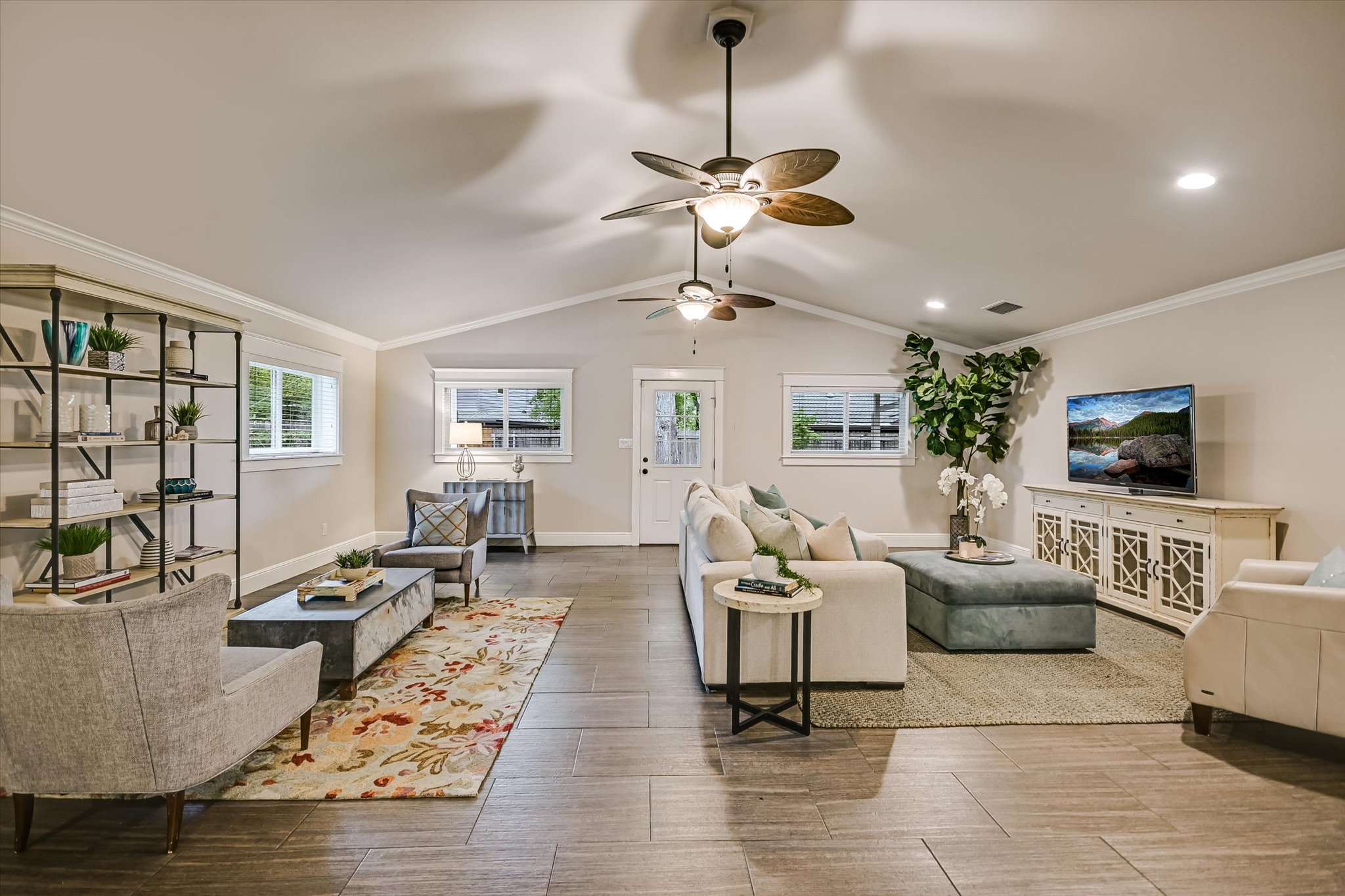 8602 Silver Ridge Drive Austin, TX 78759 - Photo 13 of 40 The expansive living room, enlarged in the 2013 remodel, comfortably accommodates an additional seating area for relaxed gathering