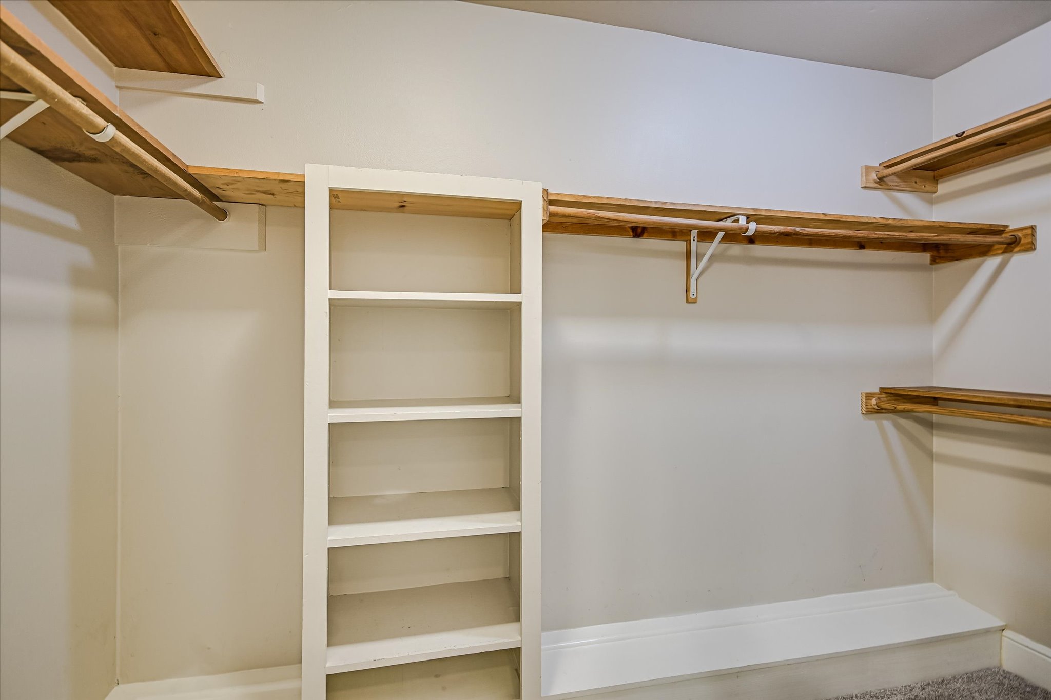 8602 Silver Ridge Drive Austin, TX 78759 - Photo 18 of 40 Exceptional storage throughout the home is evident in the generously sized walk-in closet in the primary suite.