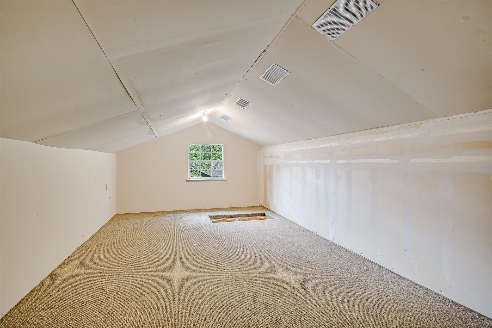 8602 Silver Ridge Drive Austin, TX 78759 - Photo 24 of 40 The carpeted 21' x 12' attic loft (not included in the square footage) offers exceptional storage and potential for future expansion.
