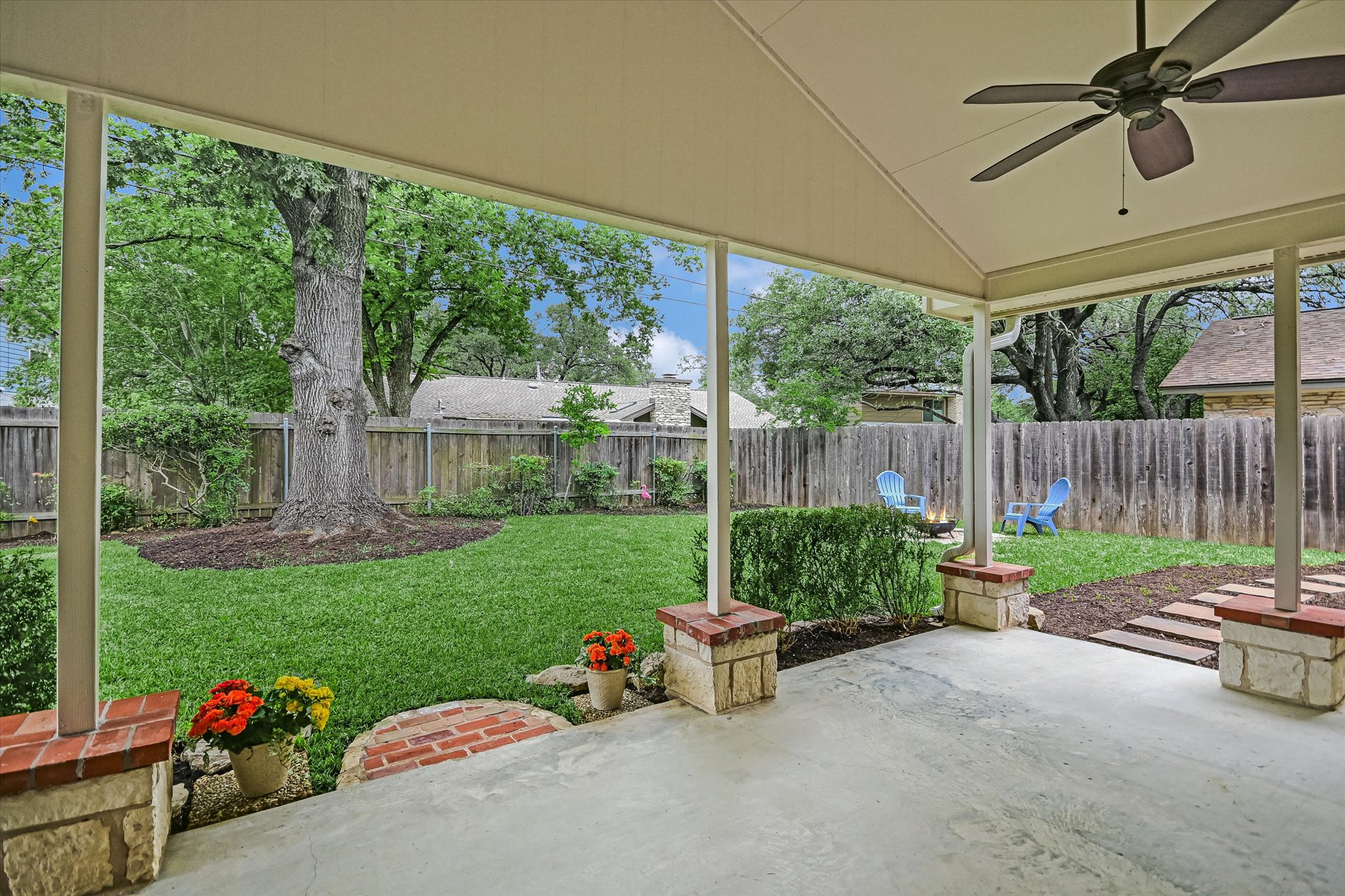 8602 Silver Ridge Drive Austin, TX 78759 - Photo 26 of 40 The expansive patio and backyard provide a peaceful setting for outdoor living and relaxation.