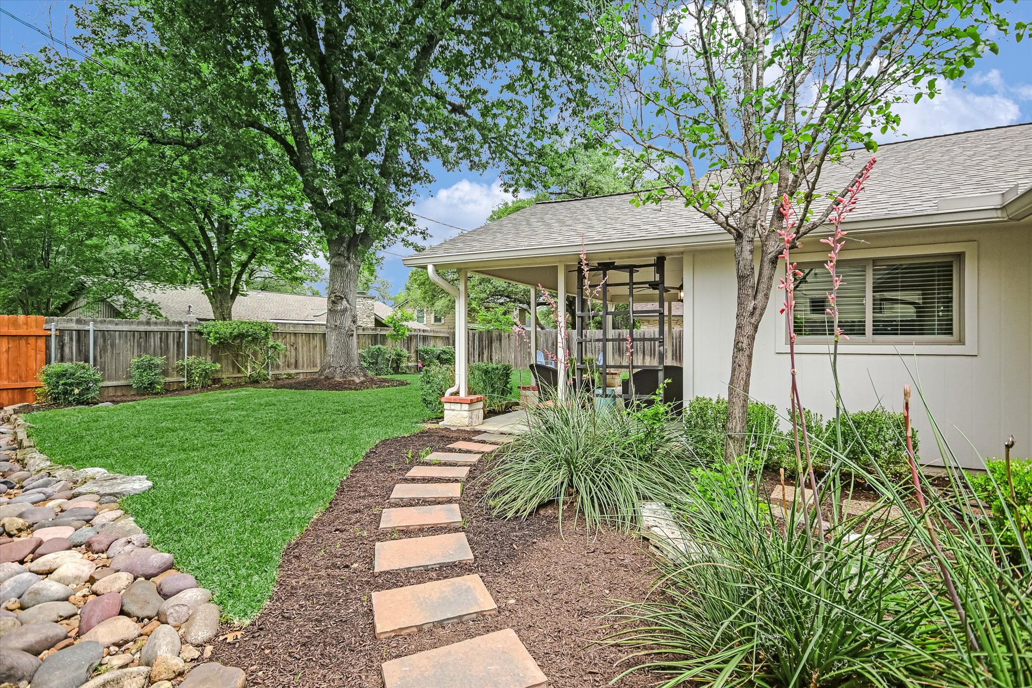 8602 Silver Ridge Drive Austin, TX 78759 - Photo 28 of 40 The side yard includes convenient stepping stones.