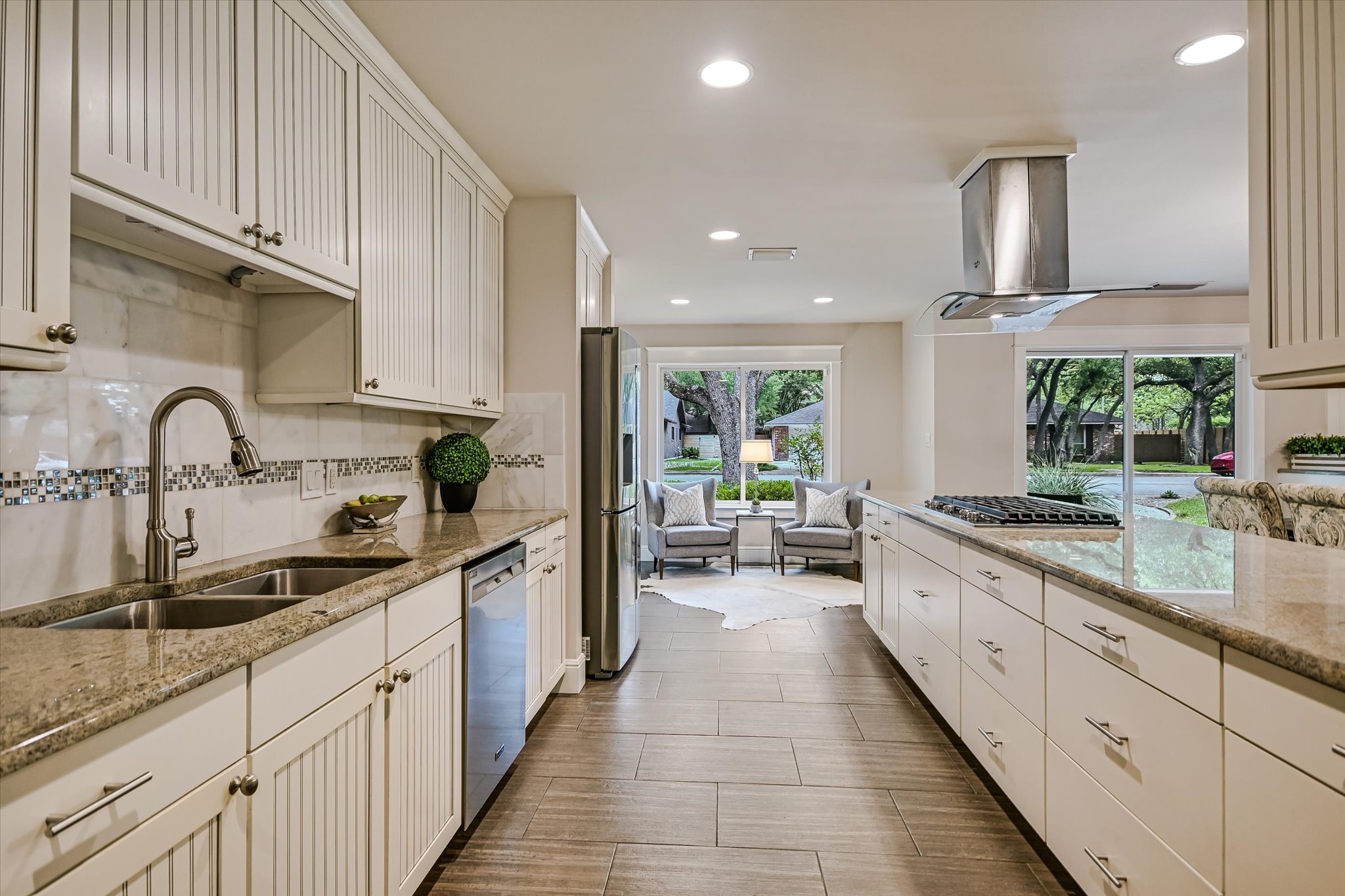 8602 Silver Ridge Drive Austin, TX 78759 - Photo 3 of 40 Fully remodeled in 2013, the kitchen showcases custom beadboard cabinetry, stainless steel appliances, and timeless finishes.