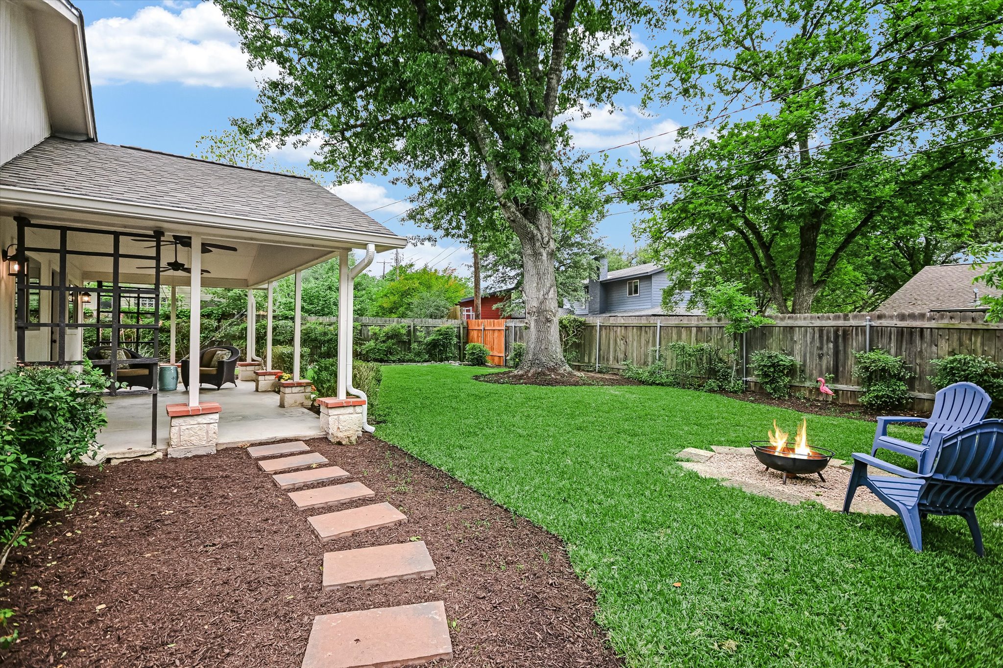 8602 Silver Ridge Drive Austin, TX 78759 - Photo 4 of 40 A covered patio and shaded backyard provide the perfect backdrop for outdoor living, dining, entertaining, and play.