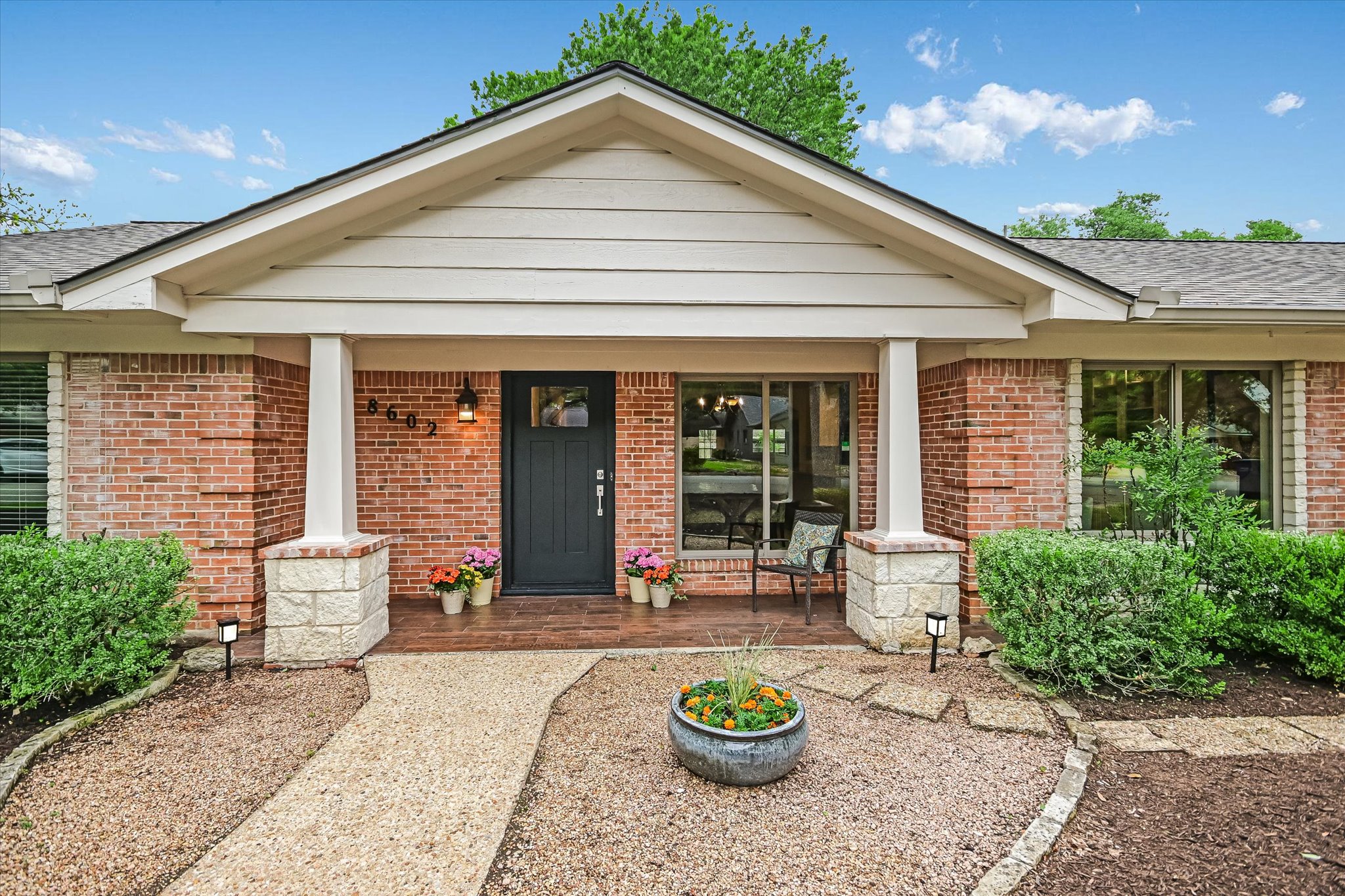 8602 Silver Ridge Drive Austin, TX 78759 - Photo 6 of 40 The charming front porch offers a gracious and inviting welcome to all who arrive.