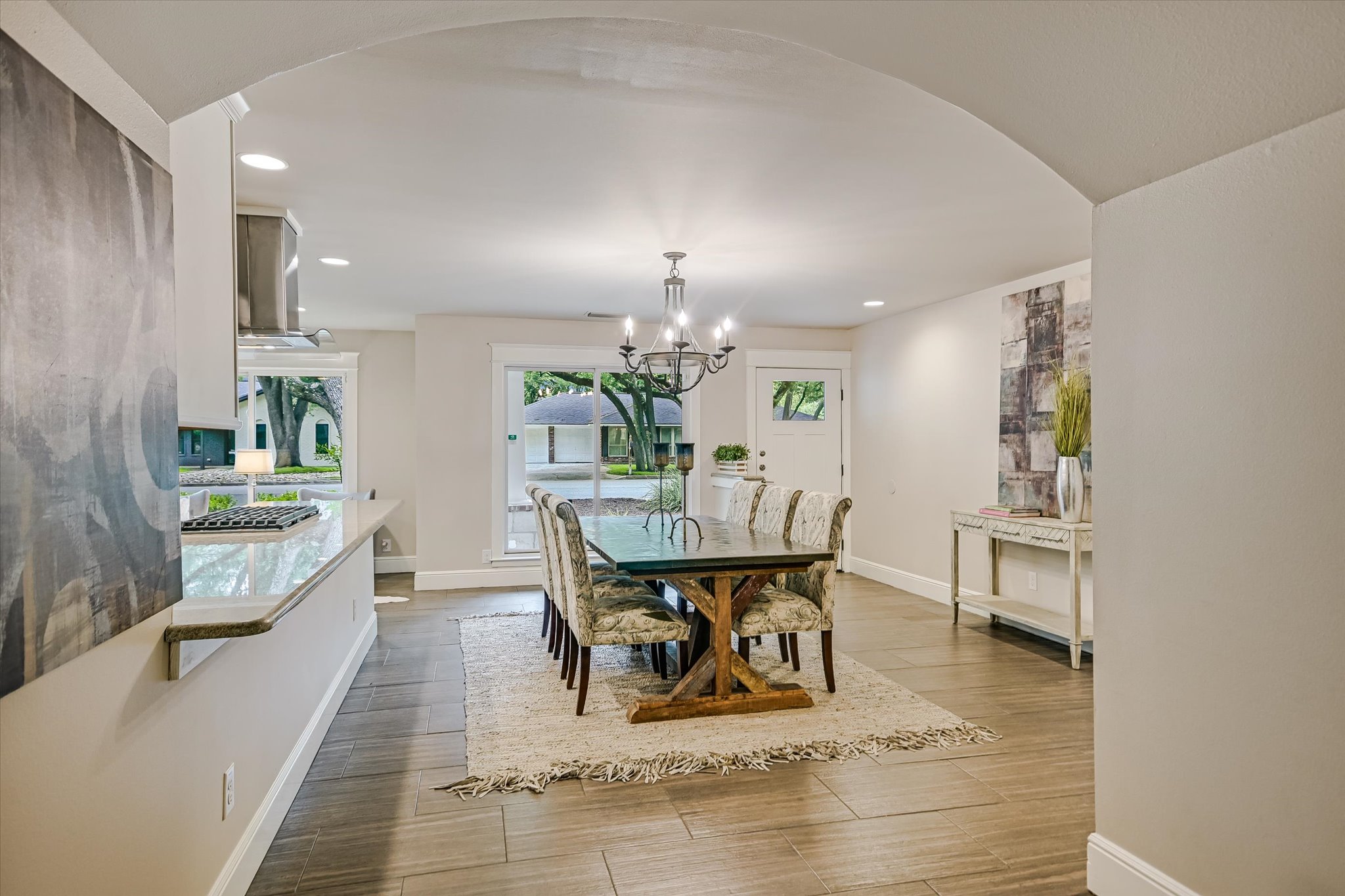 8602 Silver Ridge Drive Austin, TX 78759 - Photo 8 of 40 A striking architectural arch gracefully defines the living and dining spaces, adding an elegant design element.