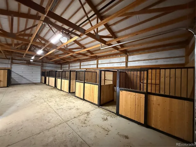 a view of an empty room with a roof
