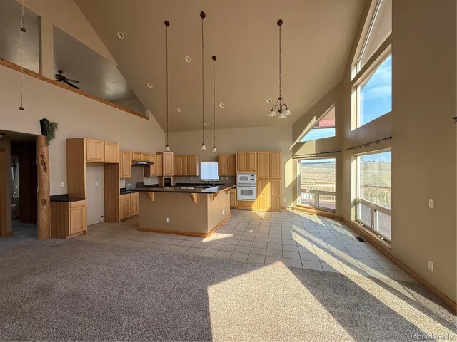 a view of empty room with a large window