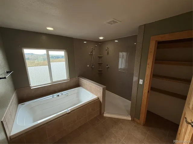 a view of a room with wooden floor and staircase