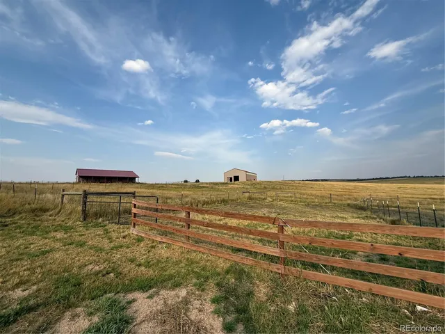 a car parked in the middle of a field