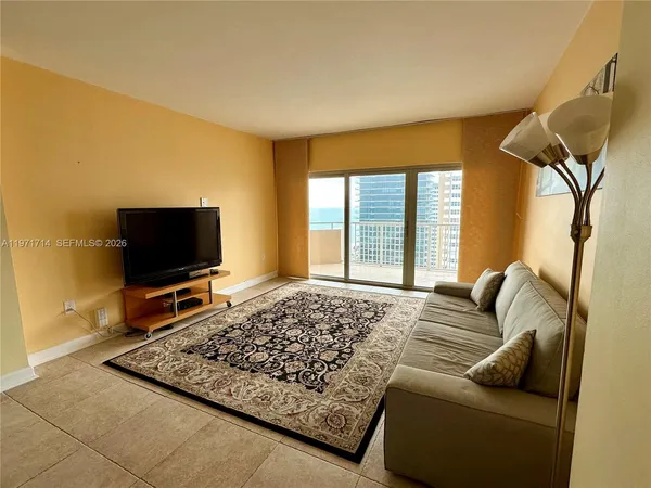 a bedroom with a bed and flat screen tv