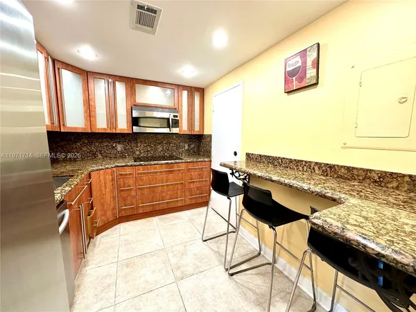 a kitchen with a sink and a window