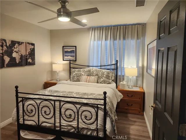 a view of a sink and a refrigerator in a kitchen