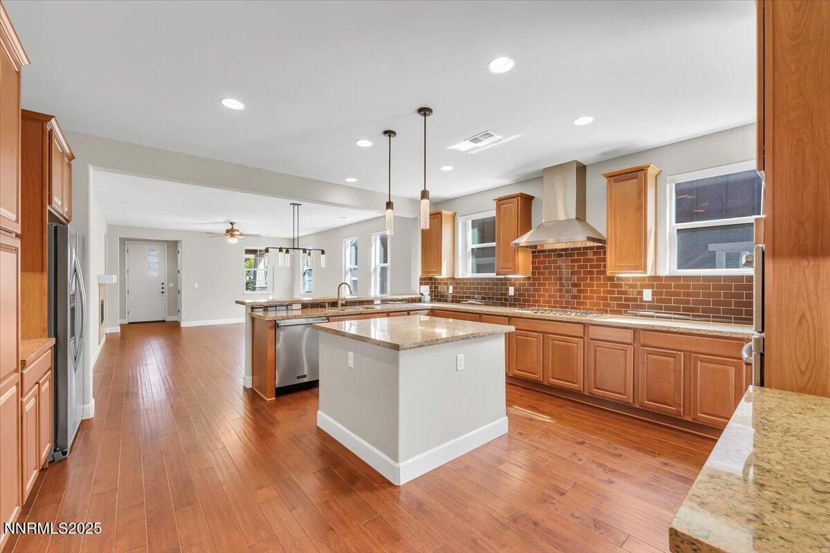 320 Mt Rose Street Reno, NV 89509 - Photo 11 of 32 a large kitchen with granite countertop a large counter top and stainless steel appliances