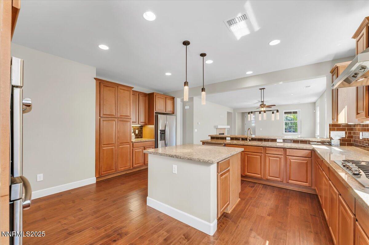 320 Mt Rose Street Reno, NV 89509 - Photo 12 of 32 a kitchen with stainless steel appliances granite countertop a sink stove and refrigerator