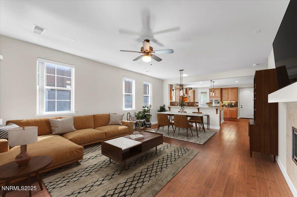320 Mt Rose Street Reno, NV 89509 - Photo 5 of 32 a living room with furniture a ceiling fan and a window