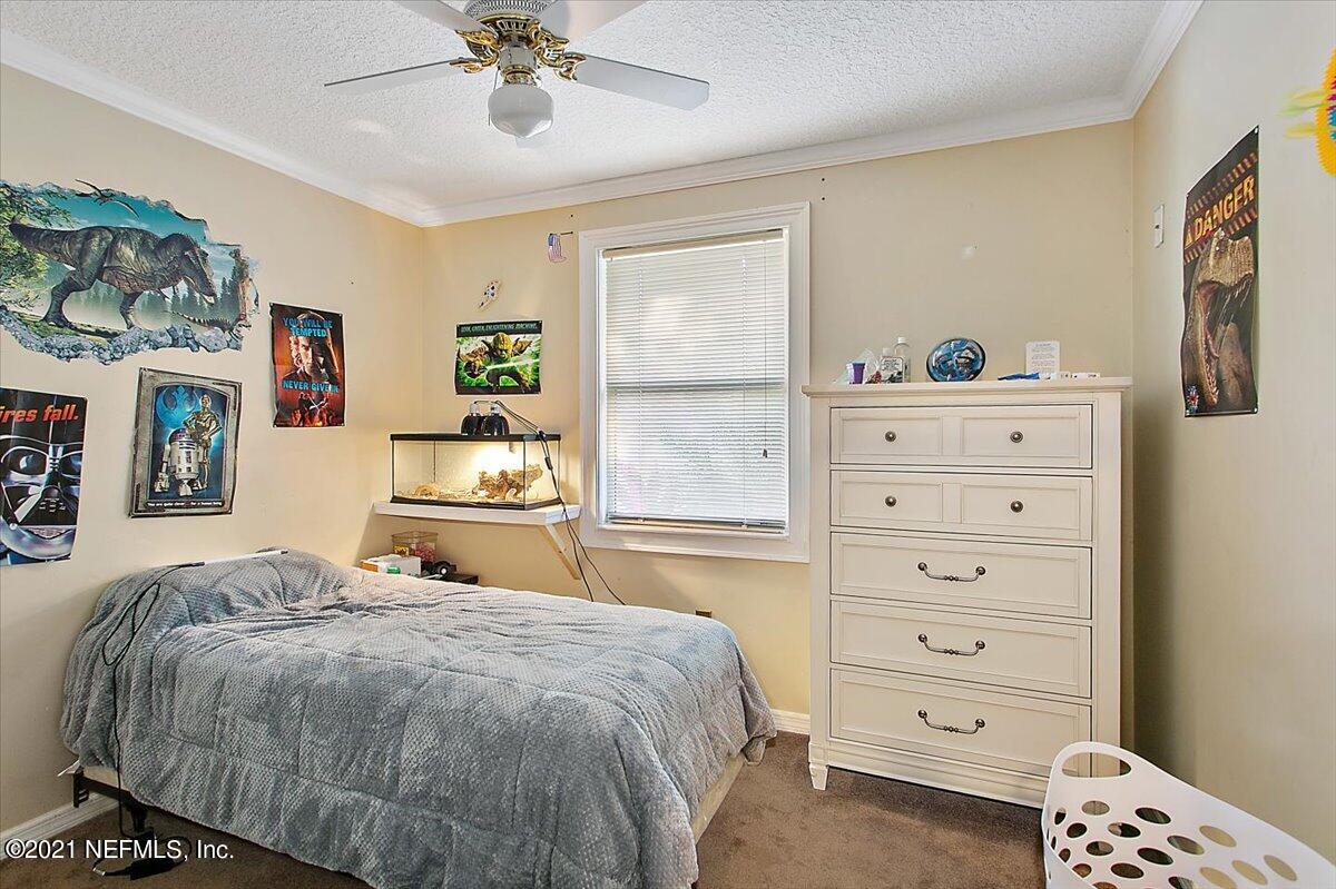 1281 Cutlass Road Orange Park, FL 32065 - Photo 14 of 21 a bedroom with a bed and a window