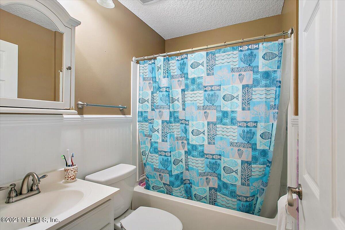 1281 Cutlass Road Orange Park, FL 32065 - Photo 15 of 21 a bathroom with a sink and a mirror
