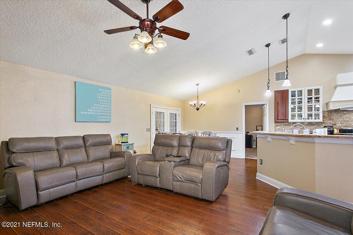 1281 Cutlass Road Orange Park, FL 32065 - Photo 4 of 21 a living room with furniture and a wooden floor