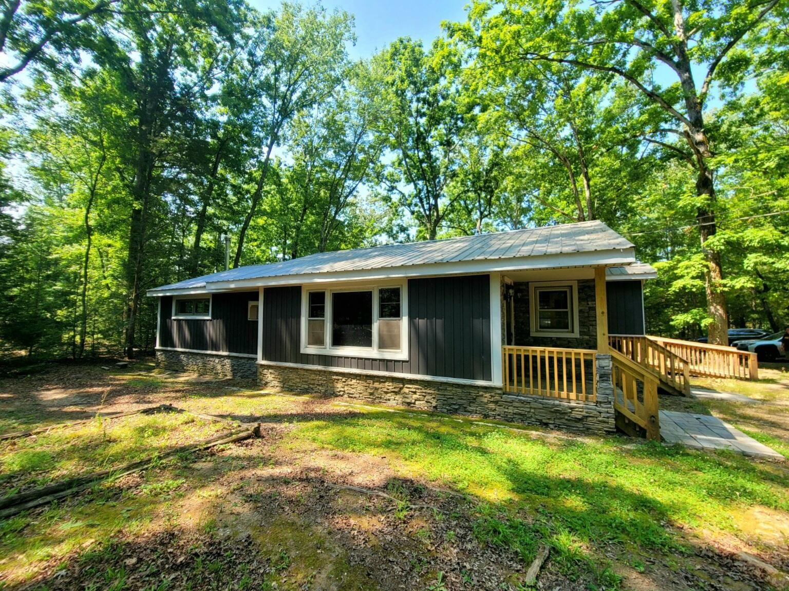840 Eagle Furnace Road Rockwood, TN 37854 - Photo 31 of 32 a front view of a house with swimming pool and porch with furniture
