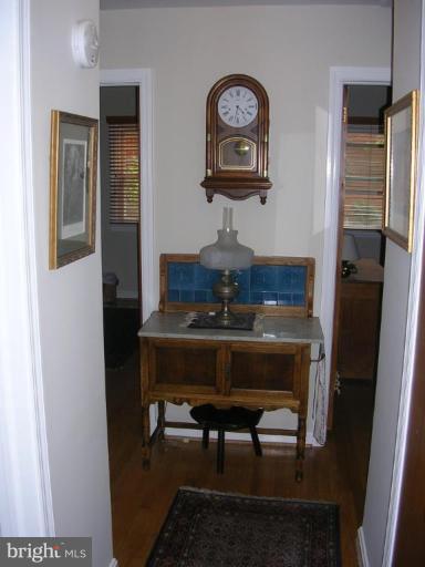 1303 Ruppert Road Silver Spring, MD 20903 - Photo 5 of 11 a room that has a table and a mirror in it