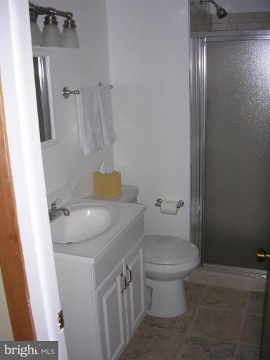 1303 Ruppert Road Silver Spring, MD 20903 - Photo 7 of 11 a bathroom with a sink a toilet and shower