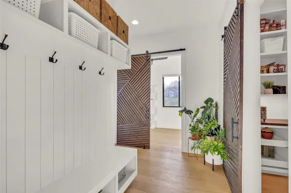 a view of entryway with wooden floor and a potted plant