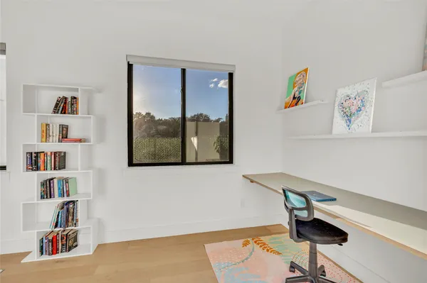 a view of a workspace with furniture and toys