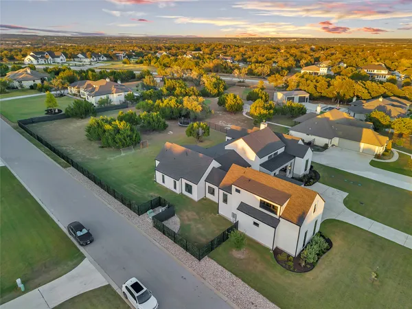 an aerial view of a house with a lake view