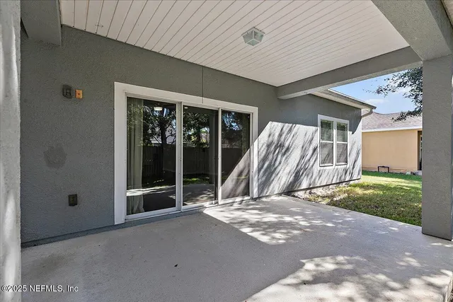 a view of a backyard of the house