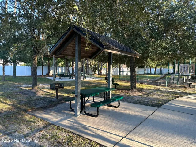 a view of a swimming pool with sitting area