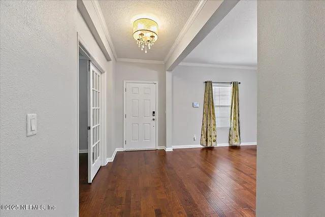wooden floor in a hall with an entryway