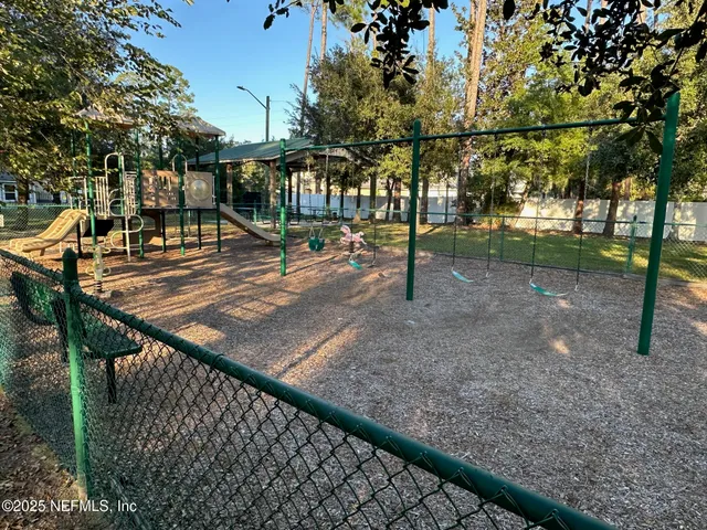 a view of a park with large trees