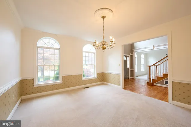 wooden floor in a hallway with a window