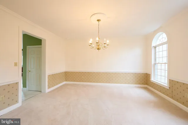 a kitchen with stainless steel appliances granite countertop a sink a stove and refrigerator