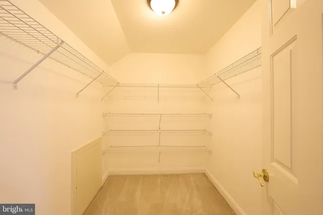 a view of a hallway with washer and dryer