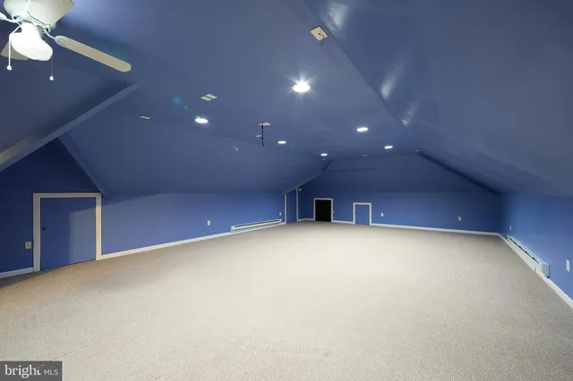 a view of a house with a small yard and potted plants