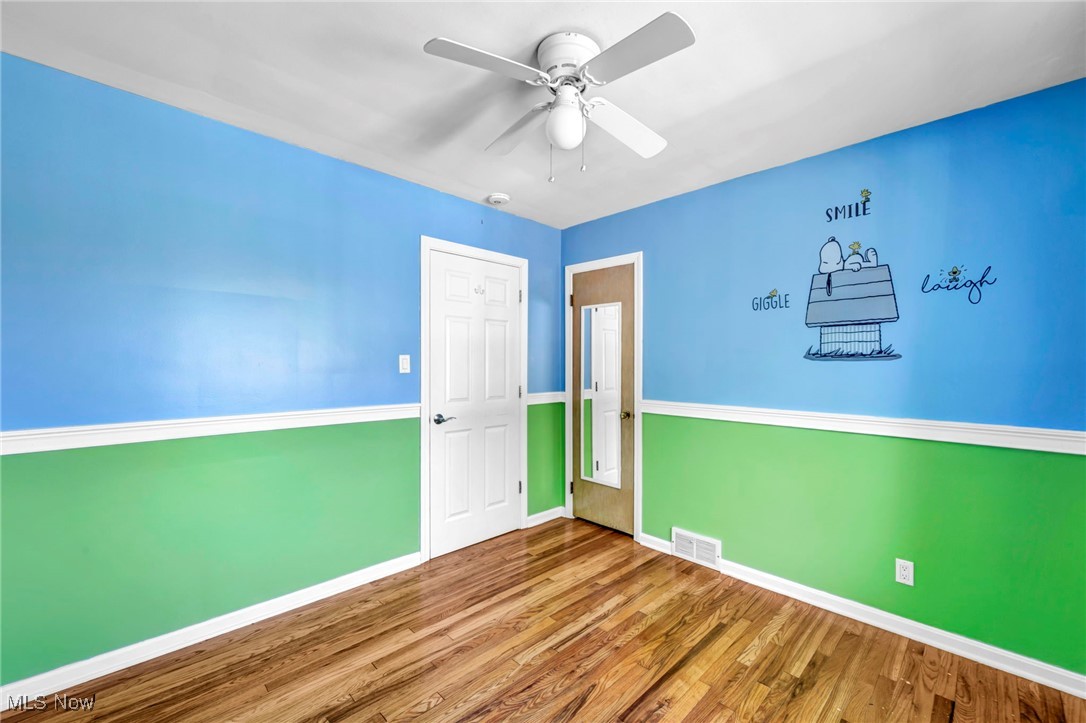 4523 Oakes Road Brecksville, OH 44141 - Photo 21 of 50 Unfurnished room featuring wood finished floors and a ceiling fan