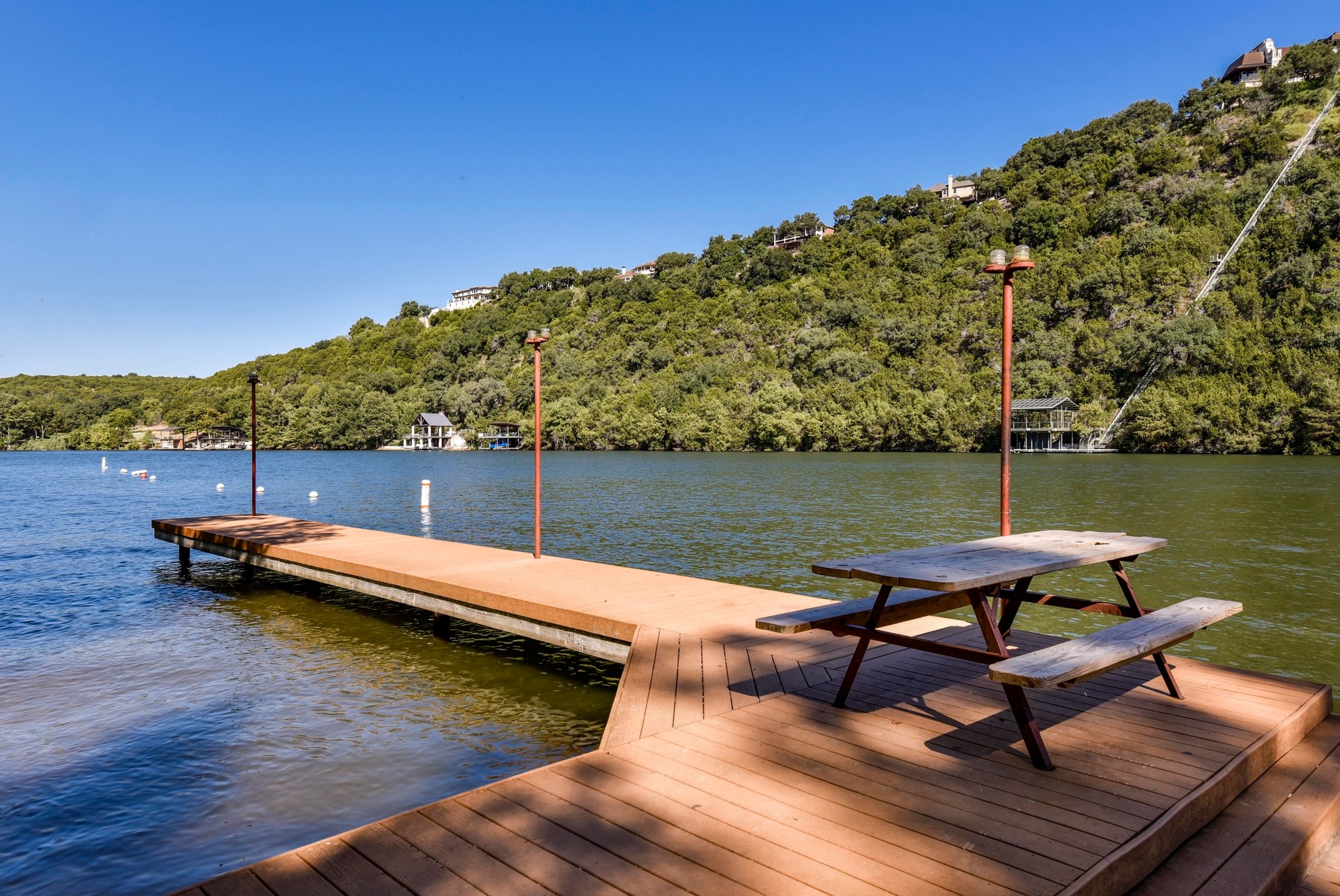 1707 Lipan Trail Austin, TX 78733 - Photo 13 of 24 a view of a lake with chairs