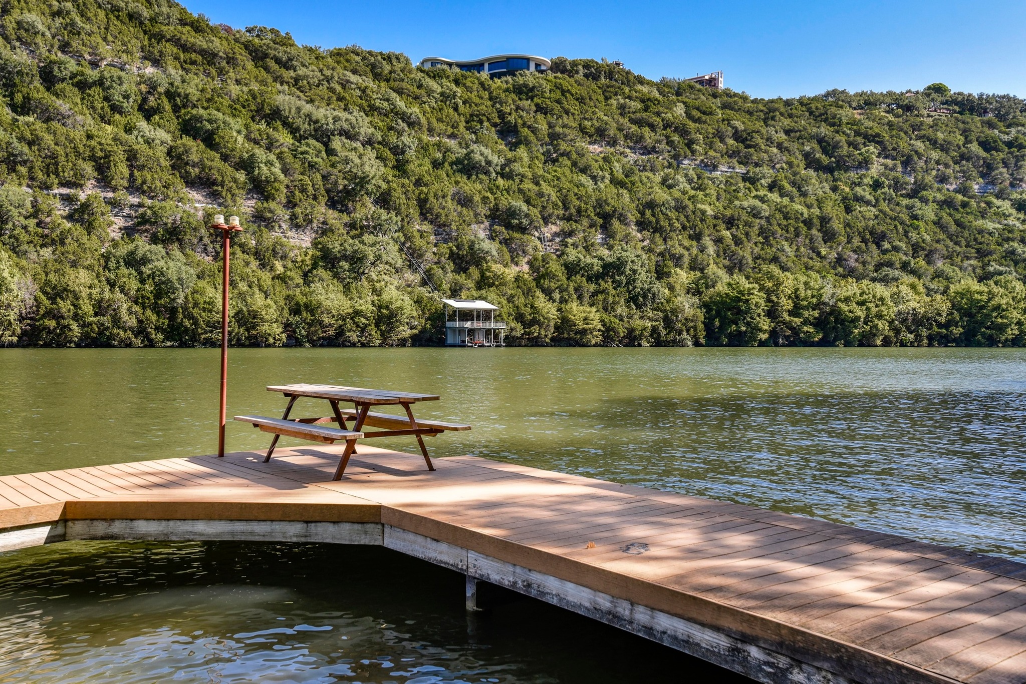 1707 Lipan Trail Austin, TX 78733 - Photo 14 of 24 a view of a lake with a yard