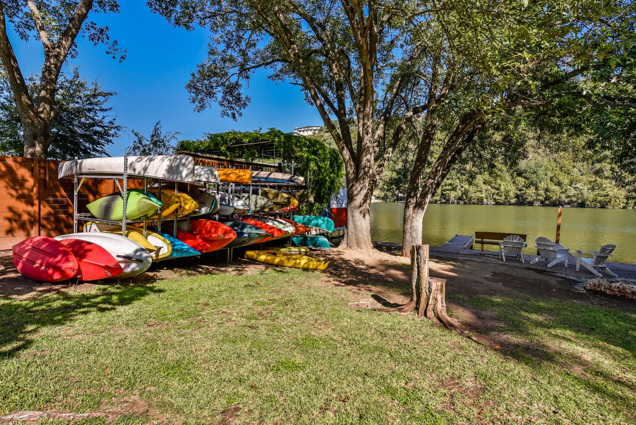 1707 Lipan Trail Austin, TX 78733 - Photo 19 of 24 a view of a backyard with a table and chairs