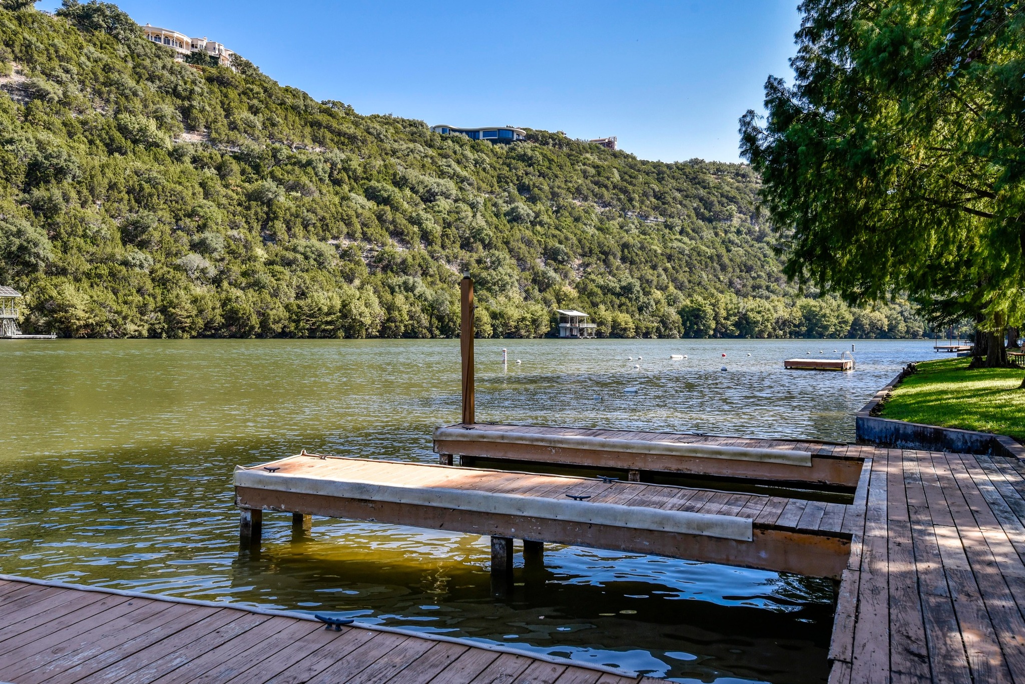 1707 Lipan Trail Austin, TX 78733 - Photo 22 of 24 a view of a lake with wooden stairs