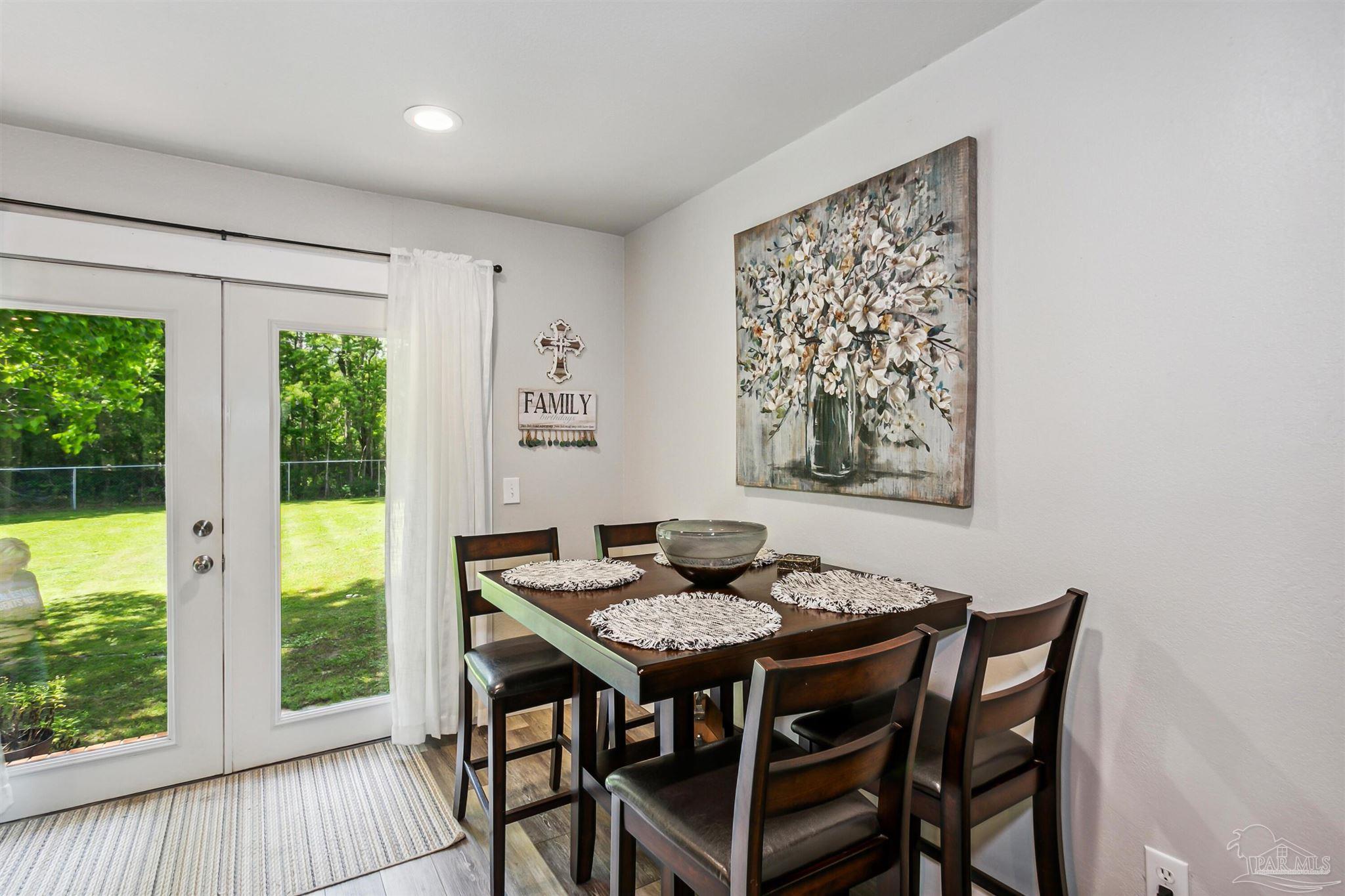 7260 Morrell Road Milton, FL 32583 - Photo 12 of 33 a view of a dining room with furniture window and outside view
