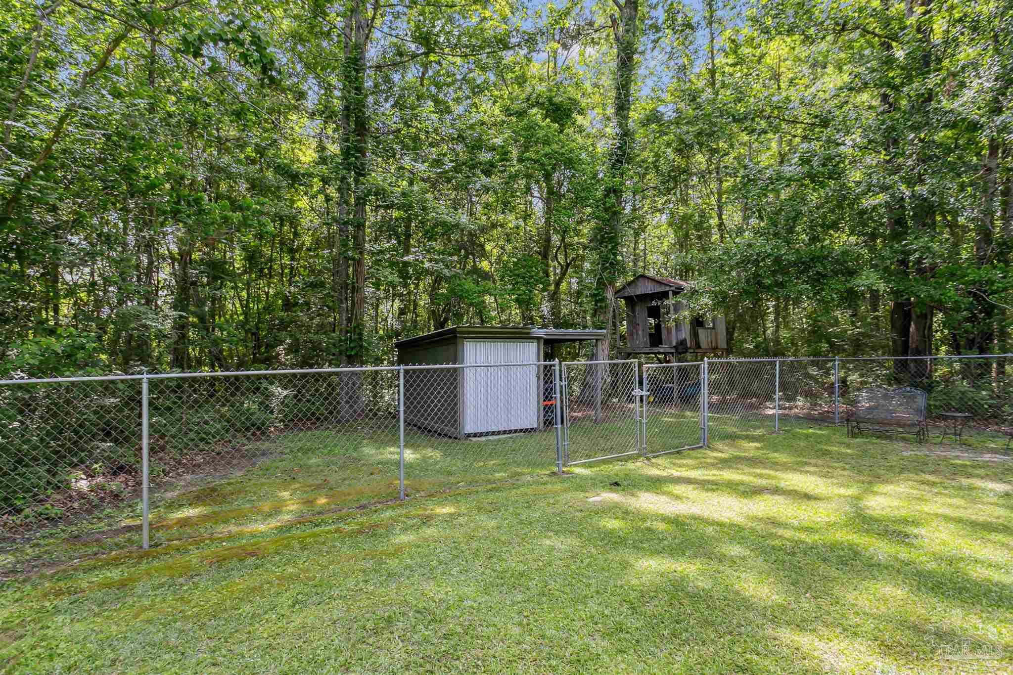 7260 Morrell Road Milton, FL 32583 - Photo 28 of 33 a view of a backyard with a small pool
