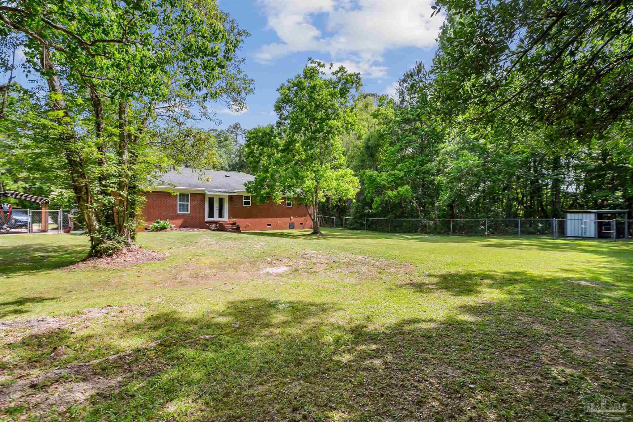 7260 Morrell Road Milton, FL 32583 - Photo 30 of 33 a front view of a house with a yard