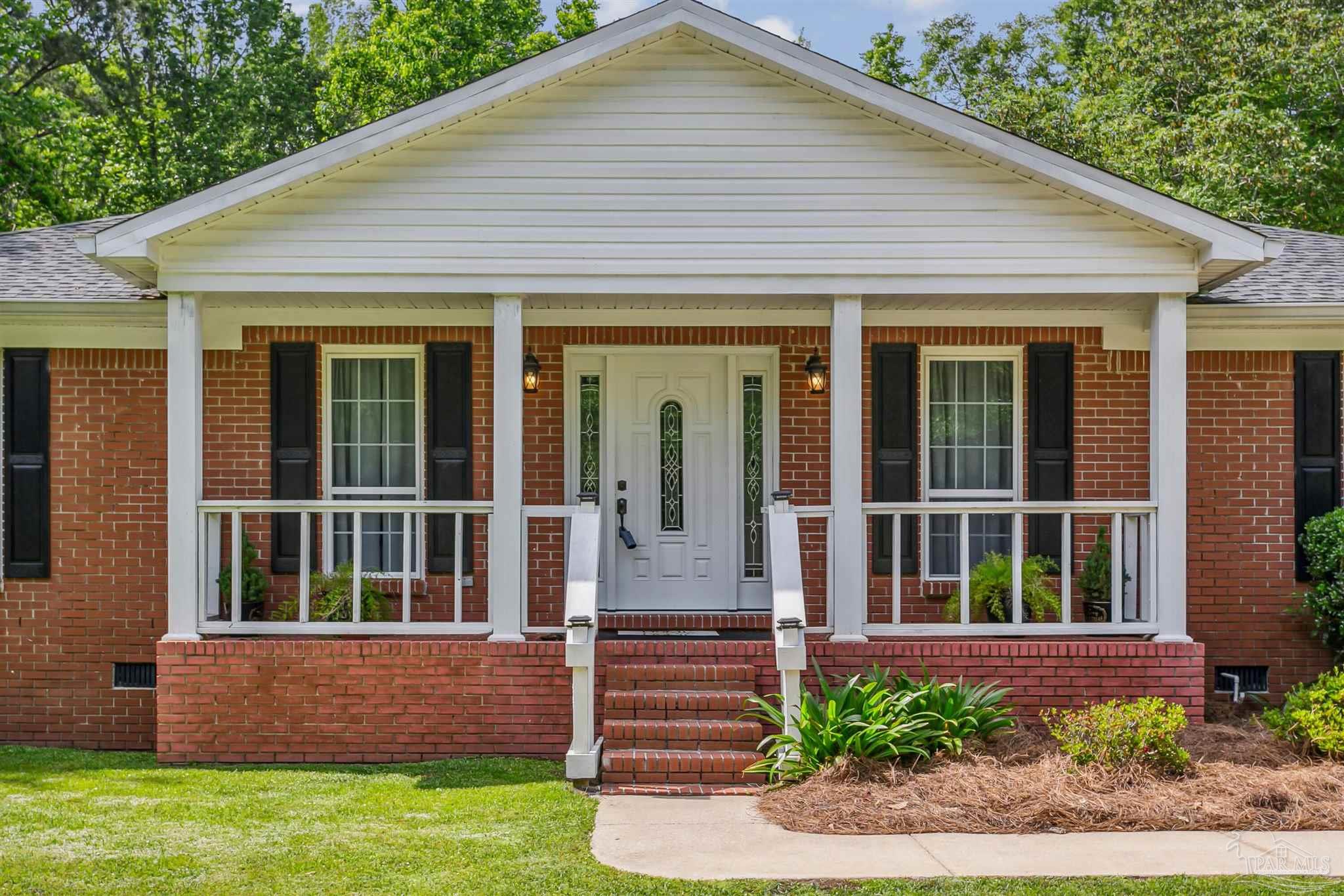 7260 Morrell Road Milton, FL 32583 - Photo 32 of 33 front view of a house with a yard